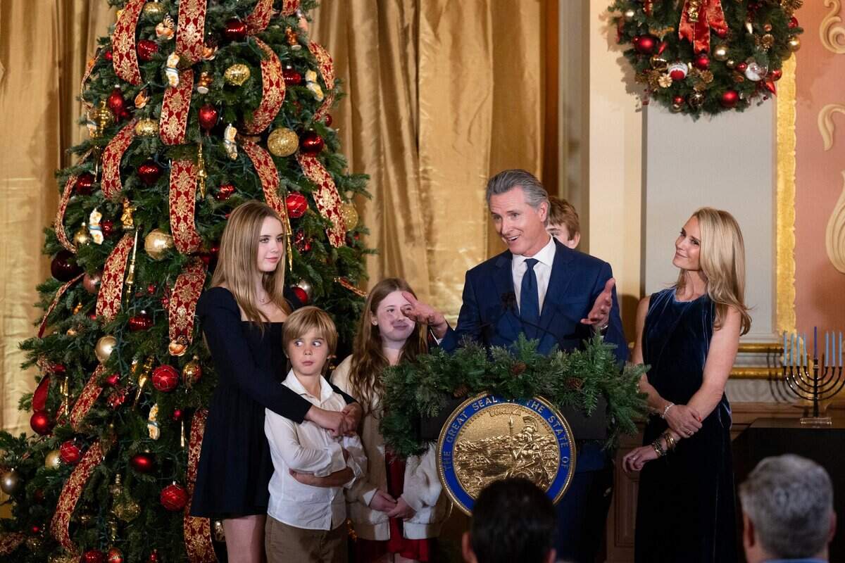 Gov. Gavin Newsom and First Partner Jennifer Siebel Newsom stand with their children before the 93rd annual lighting of the state Capitol Christmas tree on Wednesday, Dec. 11, 2024.