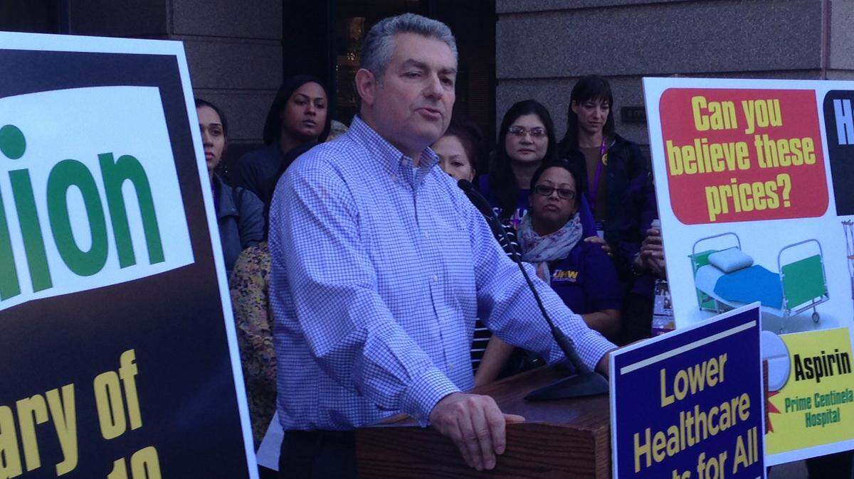 Dave Regan, president of SEIU-United Healthcare Workers West, unveils a pair of ballot initiatives in November 2013 outside the Attorney General’s Office in Sacramento.