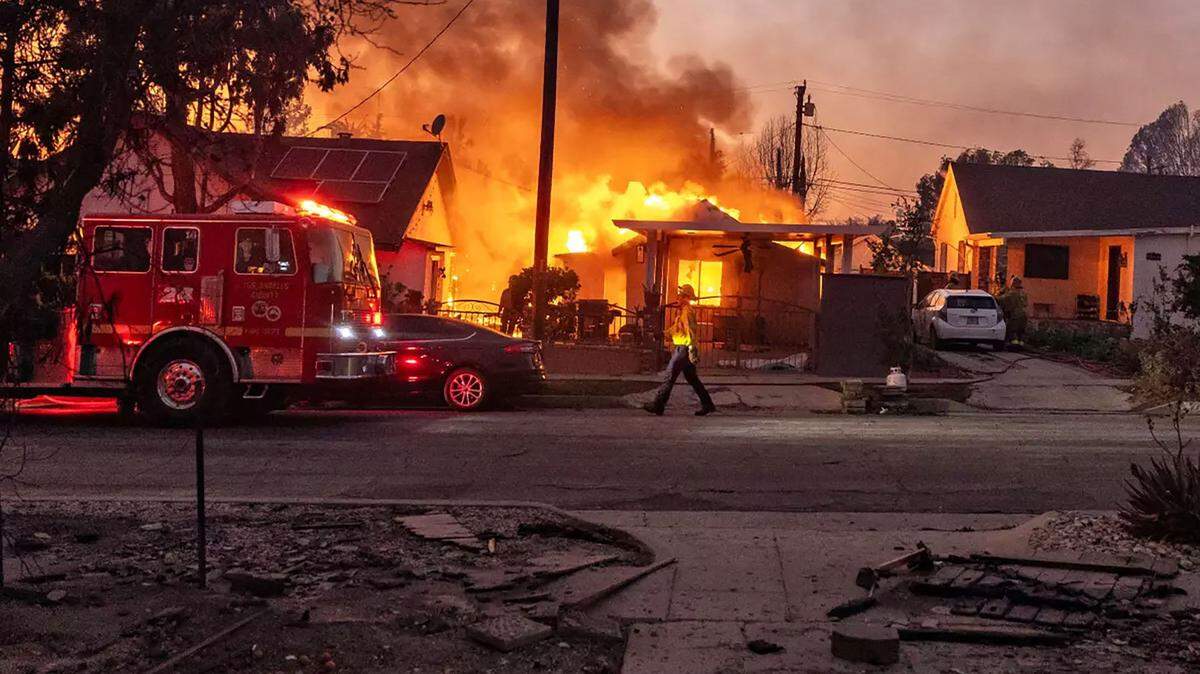 Flames from the Eaton Fire consume a home in Altadena on Wednesday, Jan. 8, 2025. California’s Wildland-Urban Interface fires leave homes contaminated with lead, arsenic and more; AB 1642 would require testing and hold insurers accountable.