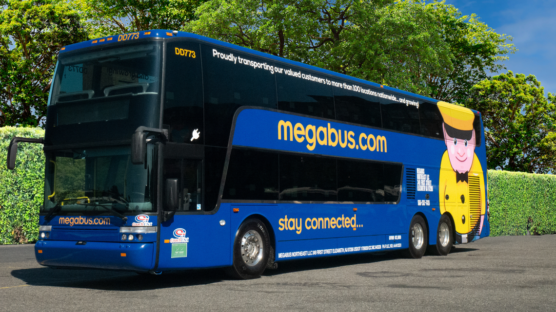 Left side view of a Megabus. The affordable bus service returns to California, offering three trips per day between seven major cities.