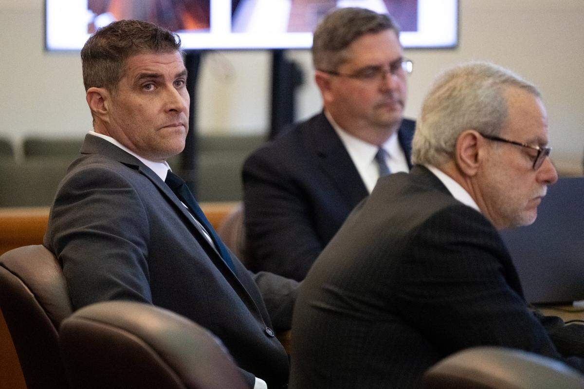 Daniel Serafini, the former major league baseball player who is on trial for the murder of his in-laws, listens to the opening arguments by the prosecution with his attorneys David Dratman and David Fischer in Placer Superior Court in Auburn on Monday.