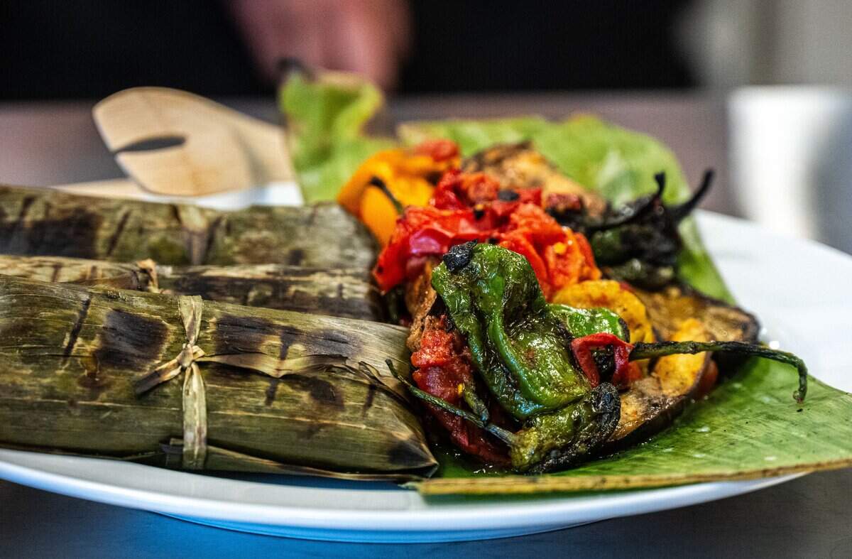 The second course, a blue corn rabbit tamal, is served with grilled summer vegetables at the Tower Bridge Dinner preview on Monday.