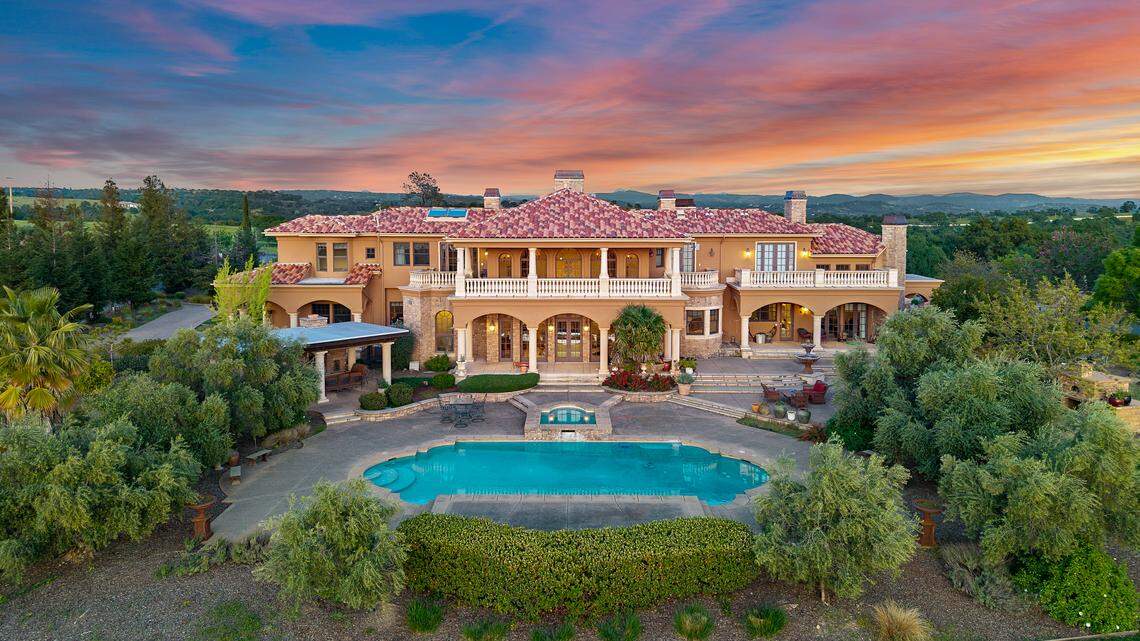 The French-inspired estate in Loomis, built in 2004, sits on five private acres with sweeping views stretching from downtown Sacramento to the Sutter Buttes and Sierra Nevada.