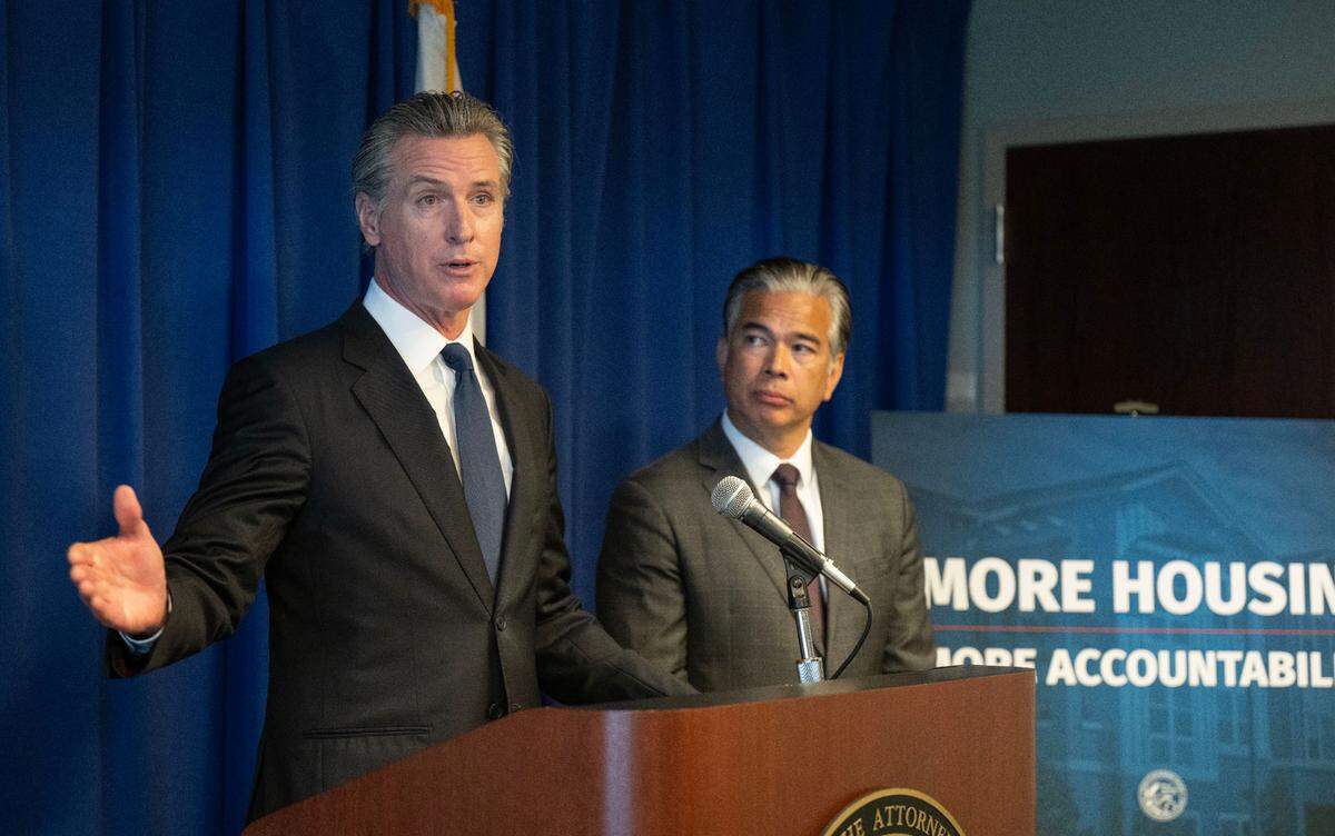 Gov. Gavin Newsom, joined by state Attorney General Rob Bonta, speaks Wednesday at a California Department of Justice press conference in Sacramento about a housing settlement with the city of Elk Grove.