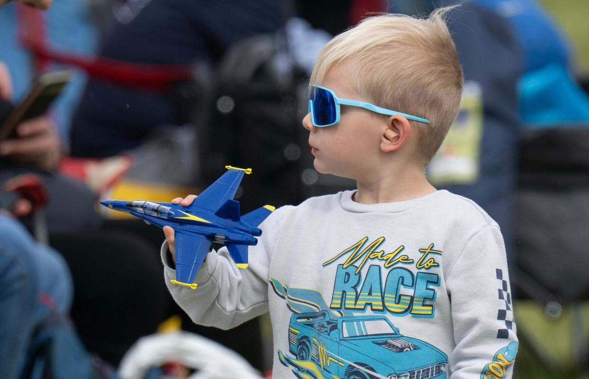 A boy plays with a Blue Angels F/A-18 during the California Capital Airshow at Mather Airport on Saturday, March 22, 2025.