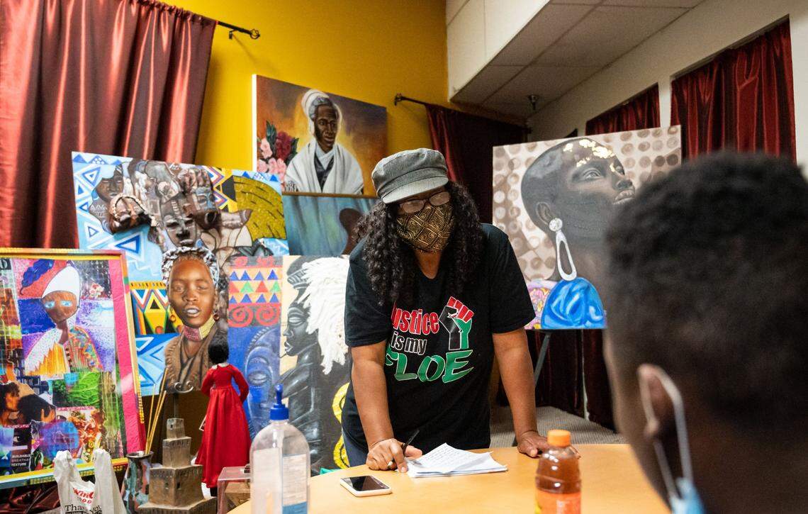 Shonna McDaniels, who founded the Sojourner Truth Art Museum in 1996, teaching a group from #SacYouthWorks while the African Market Place operates outside the museum Saturday, Oct. 17, 2020, at Florin Square in Sacramento. She was teaching the group of teenagers about business.