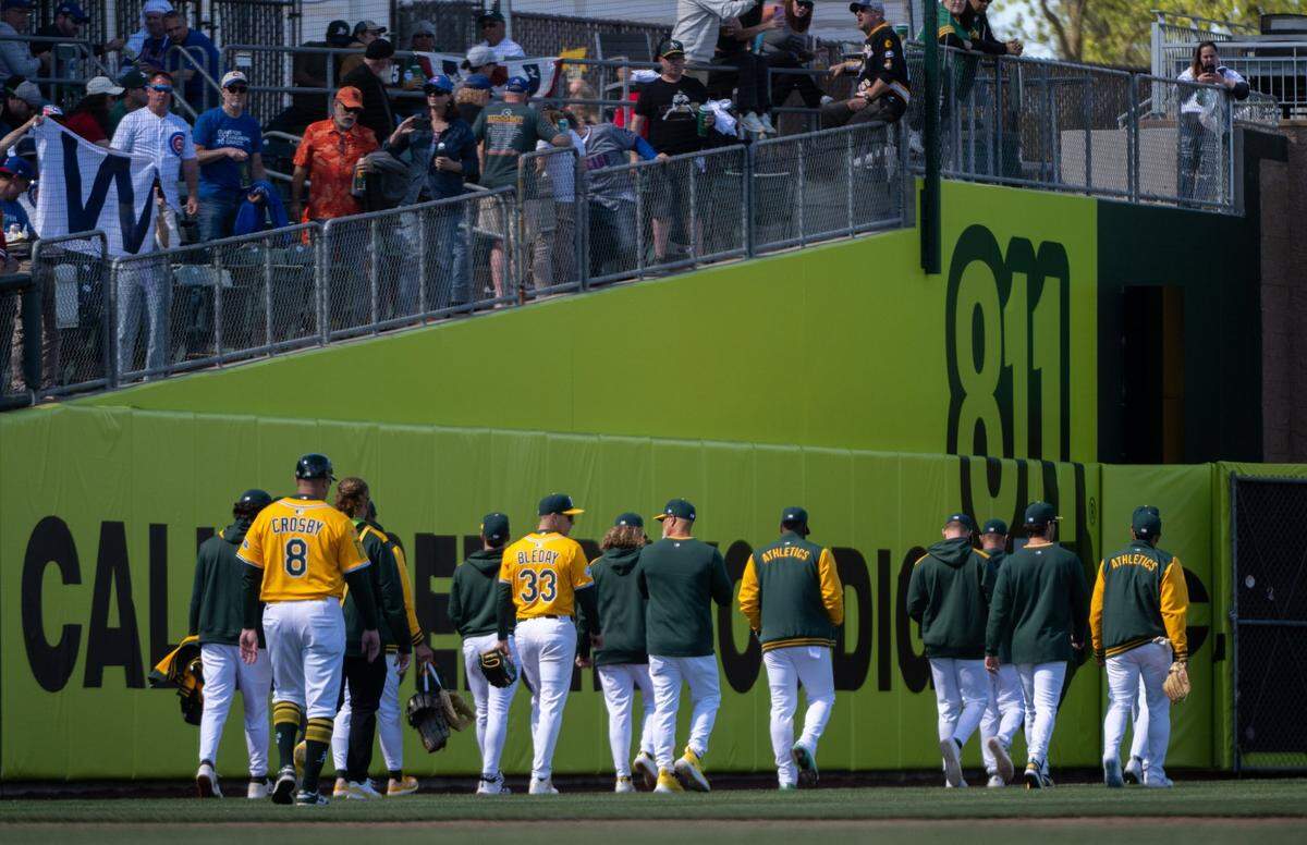 The Athletics leave the field after losing 10-2 to Chicago during a game at Sutter Health Park on Wednesday. The team was swept by the Cubs in its first series in West Sacramento.