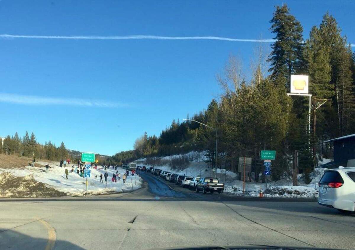 Caltrans warns travelers not to play in snow alongside freeways.