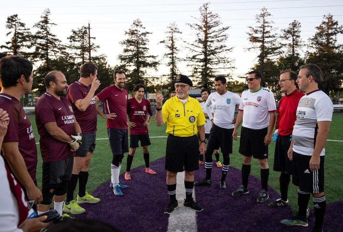State Sen. Anthony Portantino, D-La Cañada Flintridge, prepares for the coin toss in his role as head referee as state legislators from Southern California, left, and Northern California, right, prepare to play against each other in the annual Capitol Cup charity soccer game Wednesday at Cristo Rey High School in Sacramento. A check was presented to Stanford Sierra Youth and Families during halftime at the bipartisan match, which featured lawmakers wearing jerseys from clubs in their home areas and which Sacramento Republic Football Club played a large role.