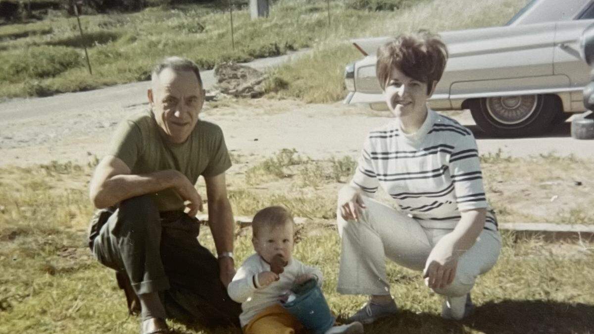 Bunny Stevens (right), her son, Douglas (middle), and her father (left) on Easter Sunday in 1970 after going to church. Douglas is enjoying his Easter goodies.