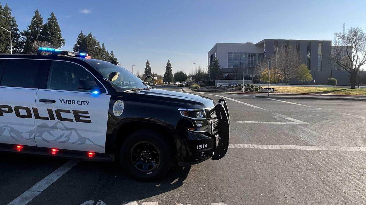 Yuba City Police patrol vehicles stand guard outside the Sutter Superior Court building in Yuba City on Tuesday, Dec. 10, 2024, following a bomb threat. Authorities have closed the courthouse for the day and issued a shelter-in-place order for several buildings nearby.