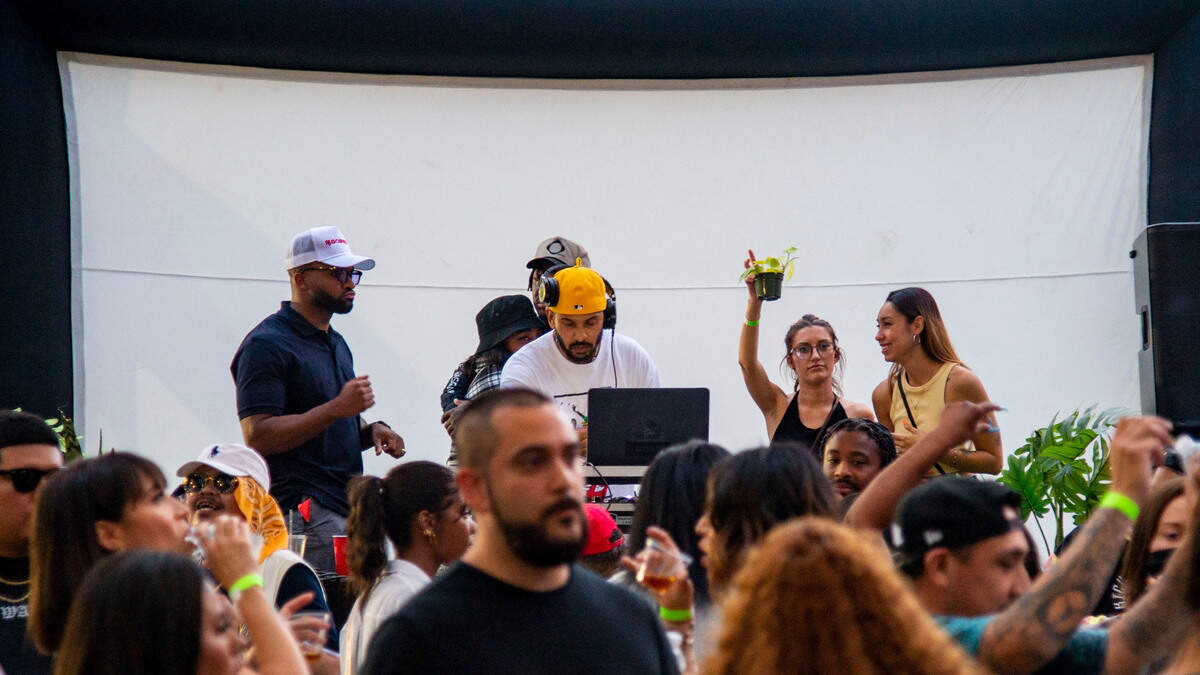 DJ’s from Baseone.fm, Kiare Thompson, left and Dante Wright-Syphax, work the stage at Algorhythm, a networking event for professionals, artists and entrepreneurs, Saturday, May 15, 2021, at Esther’s Park in Sacramento’s Oak Park neighborhood.