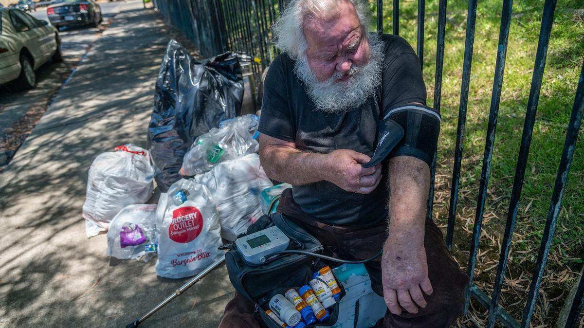 Donald Lowery balances his medicines as he checks his blood pressure on Monday, June 14, 2021, in Sacramento. He is one of about 250 people that have been kicked out of the three Project Roomkey motels in Sacramento. Its a state program that Sacramento County administers.
