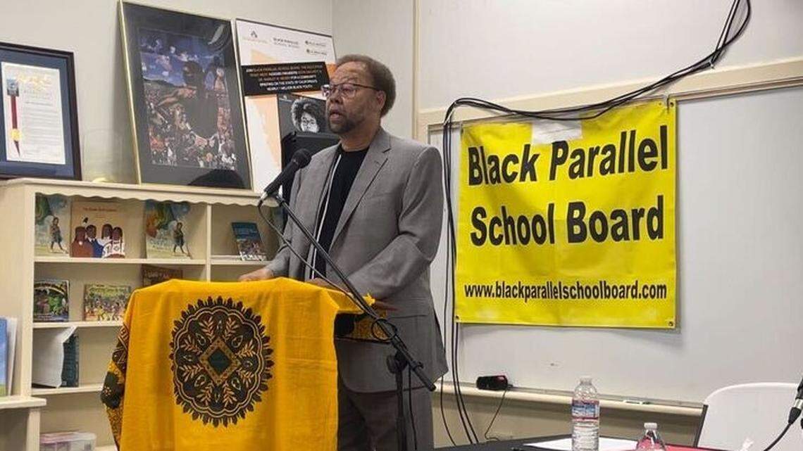 Darryl White, senior chair of the Black Parallel School Board, announces a settlement with Sacramento City Unified School District during a news conference in Sacramento in May 2023.