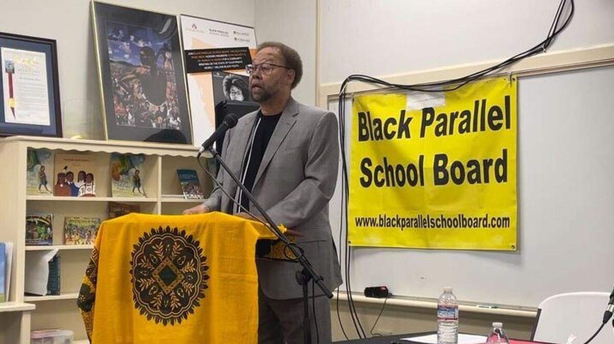 Darryl White, senior chair of the Black Parallel School Board, announces a settlement with Sacramento City Unified School District during a press conference in Sacramento on Monday.