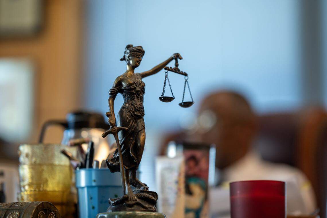 A statue of Lady Justice sits on the desk of Chief U.S. District Judge Troy Nunley in Sacramento on March 12.