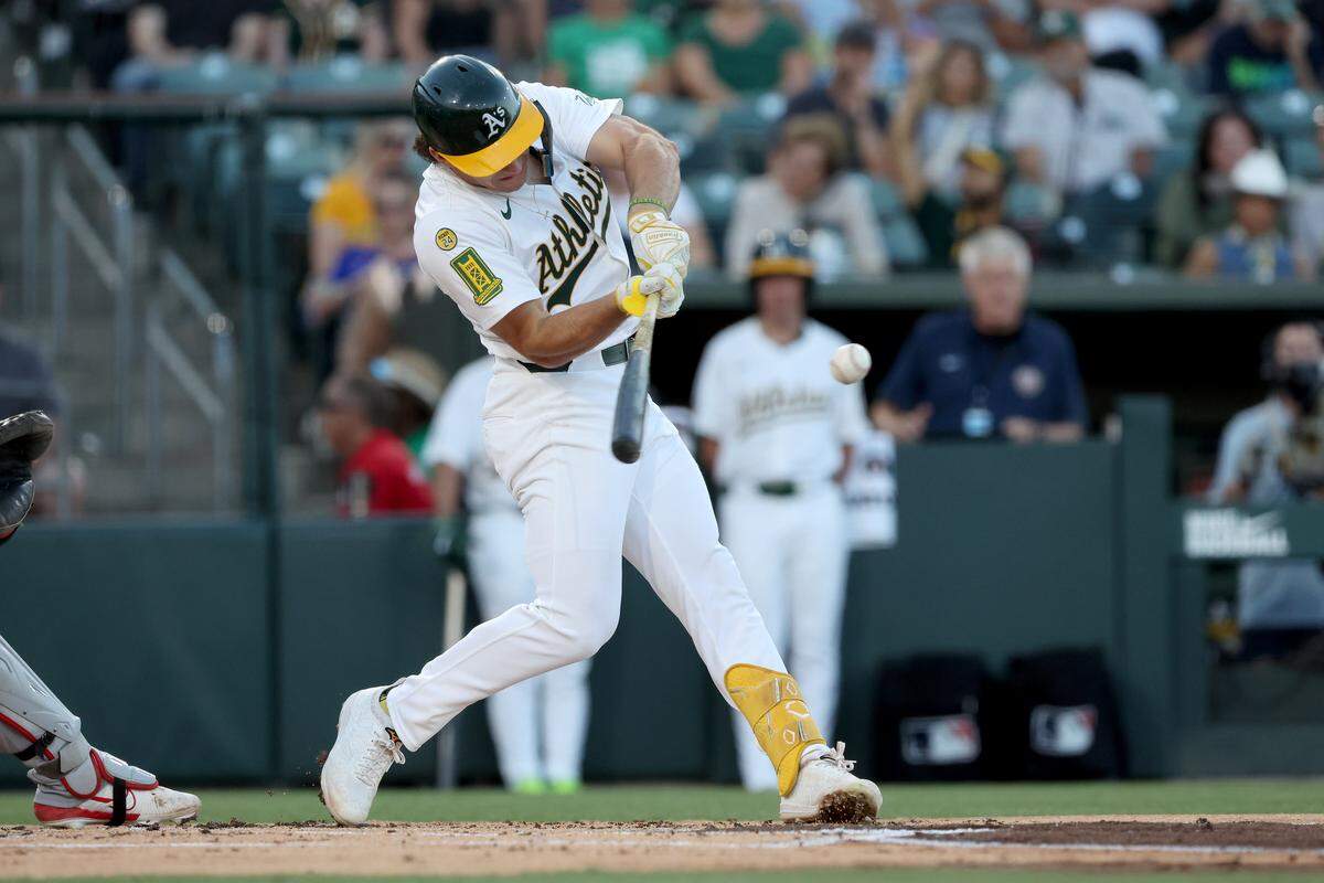 Aug 16, 2025; West Sacramento, California, USA; Athletics right fielder Colby Thomas (32) hits a two-run home run against the Los Angeles Angels during the first inning at Sutter Health Park. Mandatory Credit: Dennis Lee-Imagn Images