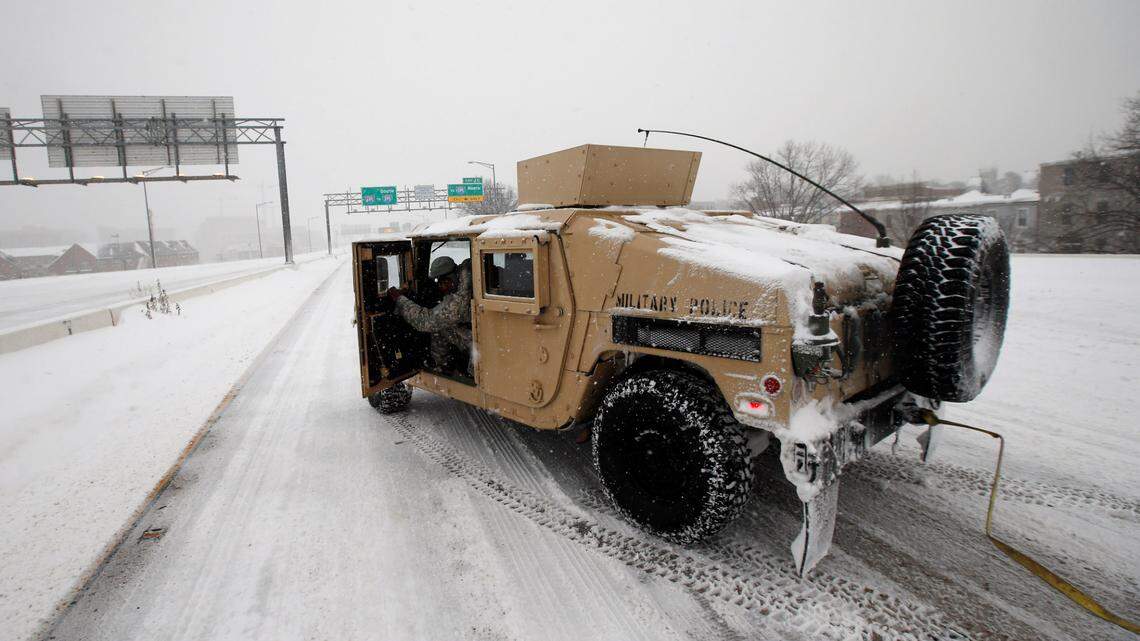 A soldier in a Humvee stops to assist a stranded motorist in 2016 in Washington. A California, man led police on a chase in a stolen military Humvee and will spend 34 months in prison, federal officials say.