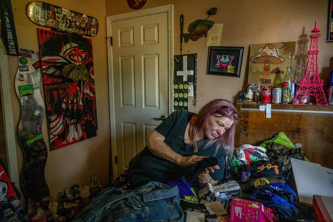 Cheryl Pringle caresses a wool hat her son loved, alongside his favorite jean jacket in his room at their home in Rosemont on May 19, two years after his death. She said she seldom enters it because it’s too painful. “I very rarely come into his room, but I walk by and I’ll always say, ‘I’m home,’ or I’ll let him know I’m talking to him through a closed door. He’s not here, but in my mind he is — he’s still here.” she said.
