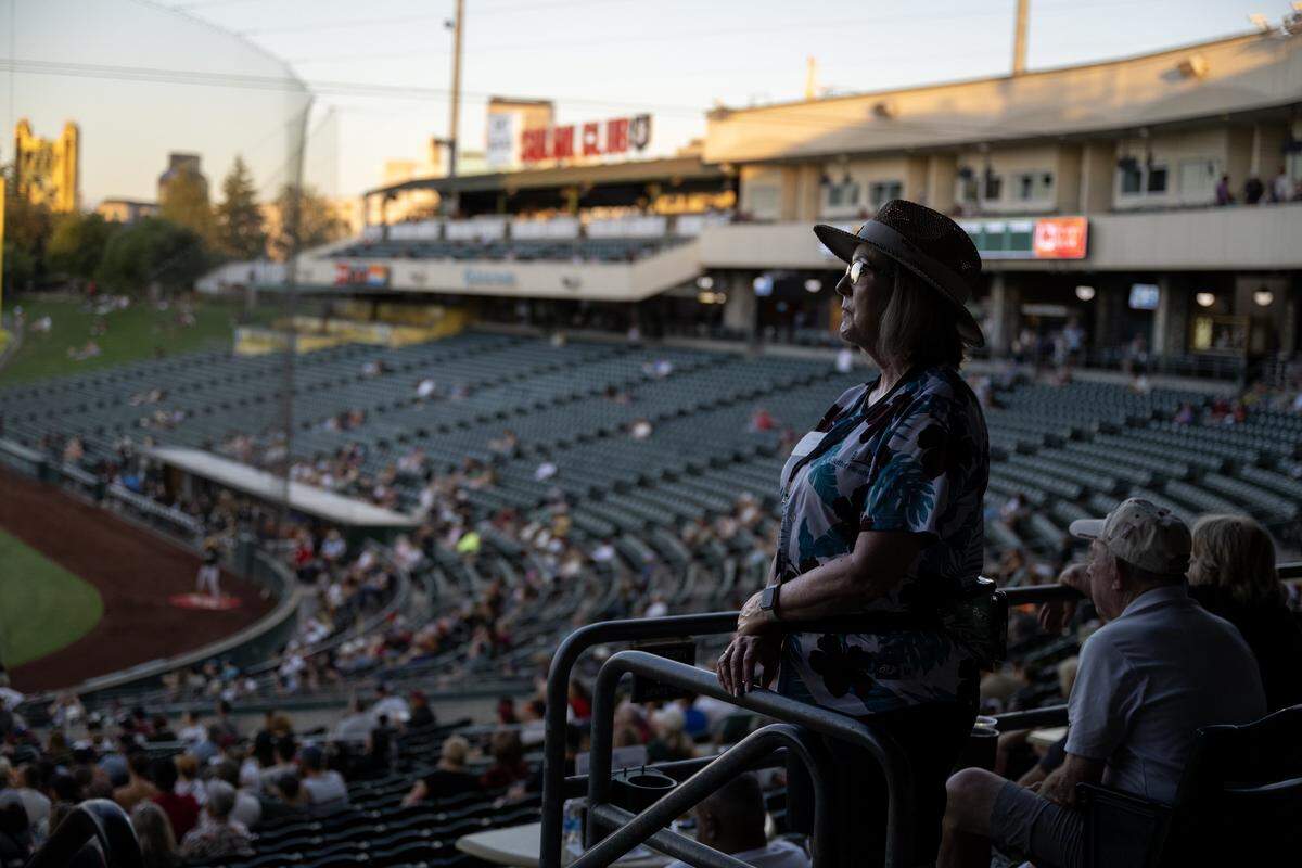 Guest attendant Kelly Jacobus works the section behind home plate earlier this month at Sutter Health Park in West Sacramento.