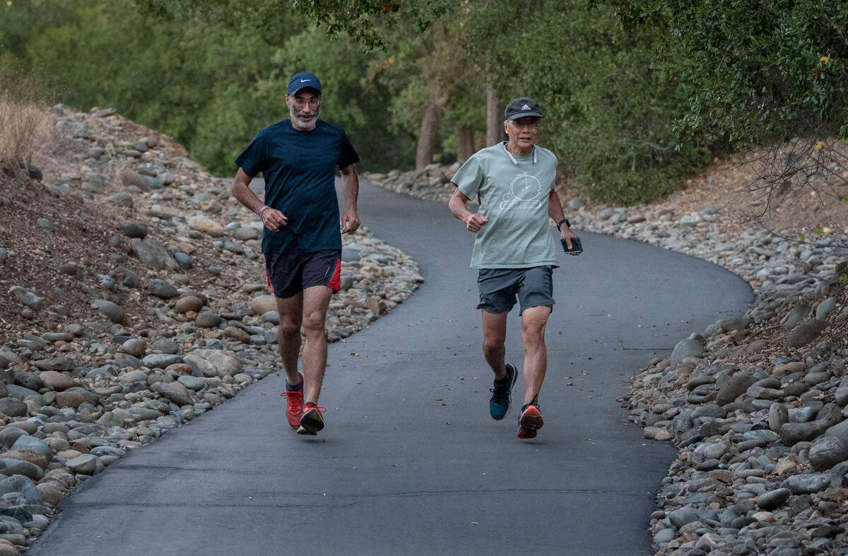 Dr. Karanjit Singh, left, a Dignity Health cardiologist, runs with one of his patients, William “Bill” Wong on Friday in Gold River in preparation the Urban Cow half-marathon on Sunday. Singh will be running with about 15 of his patients but the idea was birthed when he sought to help Wong, 71, gain more confidence in the health of his heart after he survived a couple cardiac episodes.