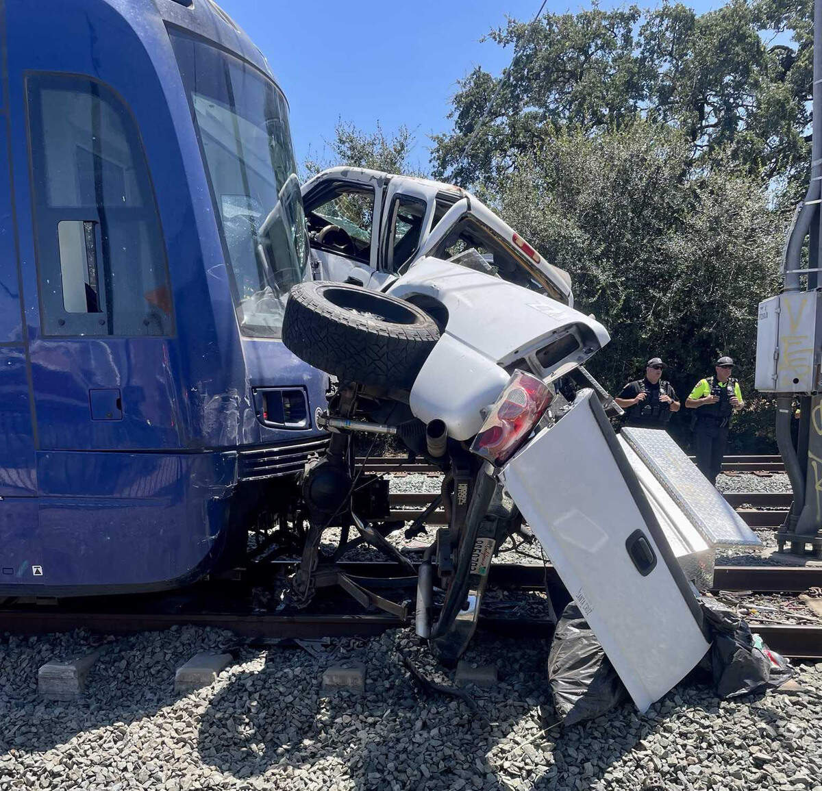 A Sacramento Regional Transit light rail train remains stopped after colliding with a Chevrolet Silverado pickup truck at Folsom Boulevard and Kilgore Road in Rancho Cordova on Friday, July 3, 2026. The pickup driver suffered critical injuries.