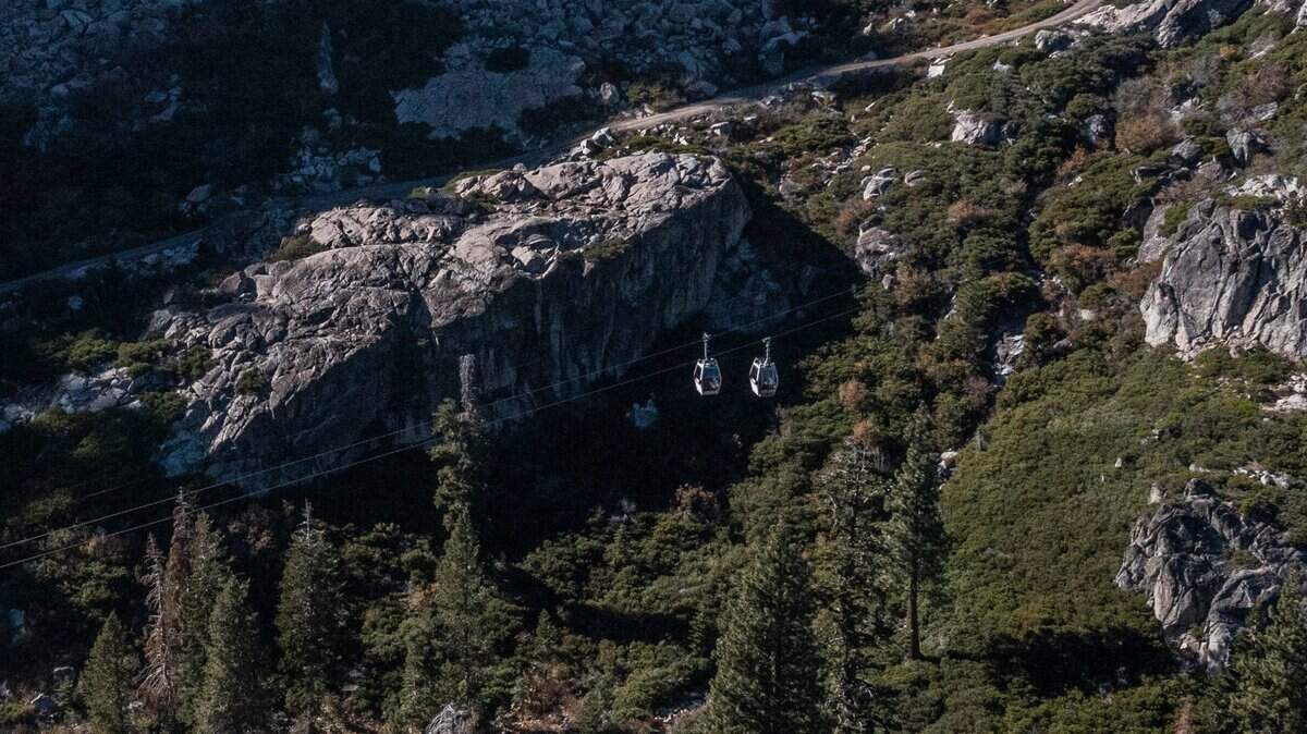 Two cabins traverse the Base to Base Gondola route at Palisades Tahoe on Thursday, Oct. 27, 2022, as construction continues on the project. It’s expected to begin operation in December.