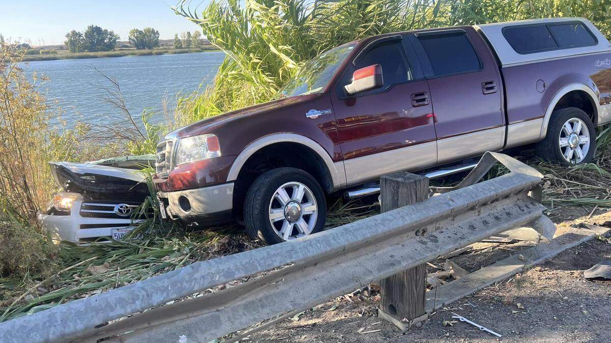 One person died and multiple people were injured in a traffic collision. One car went into the water and another down the embankment, authorities said.