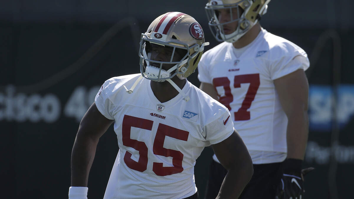 San Francisco 49ers’ Dee Ford (55) stretches in front of Nick Bosa at the team’s NFL football training camp in Santa Clara, Calif., Saturday, July 27, 2019. (AP Photo/Jeff Chiu)