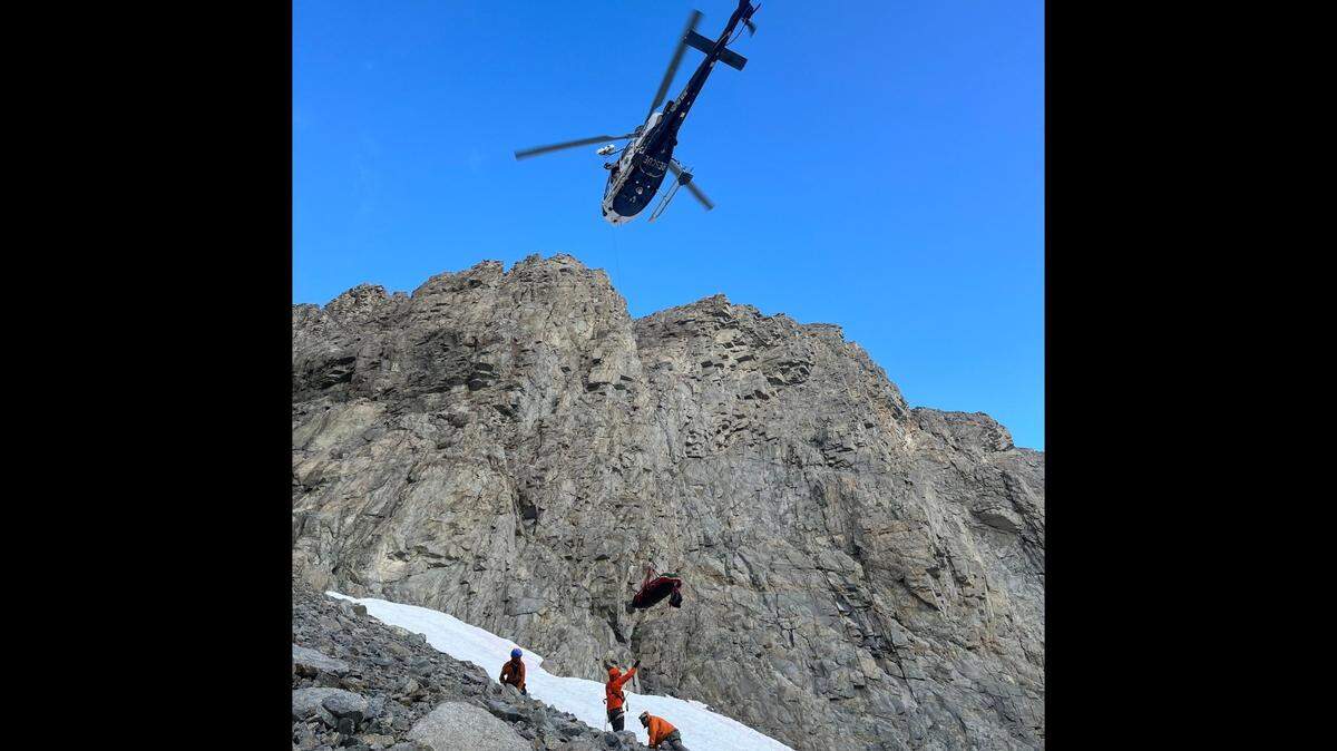 An injured hiker was rescued after trying to cross a snowfield without proper equipment, California rescuers say.