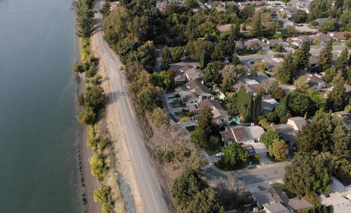 Sacramento will acquire portions of several parcels near Arabella Way to extend the levee trail along the Sacramento River in the Pocket neighborhood north from Garcia Bend Park. A drone image shows part of the levee in the area on Oct. 10.