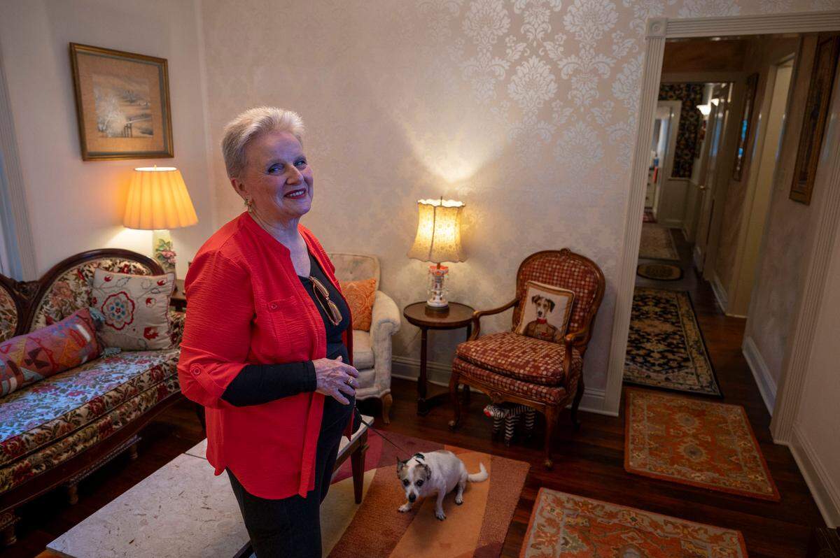 Rebekah Christensen stands in front in the front room of her 632-square-foot Boulevard Park home she calls “Little House” on Sunday, August. 25, 2024. The historic home built in the 1890’s has survived years of redevelopment.