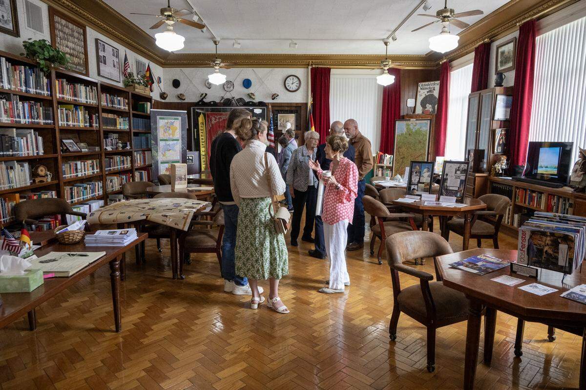 Susie Pelz, president of the library at Turner Hall, greets guests on April 25 as Sacramento Turn Verein celebrates the 100-year anniversary of its current building. 