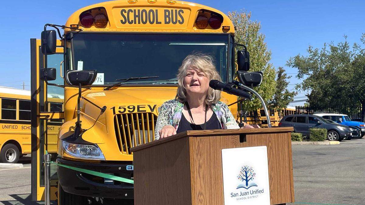Pam Costa, president of the San Juan Unified School District board, introduces the district’s six new electric buses on July 25, 2024.