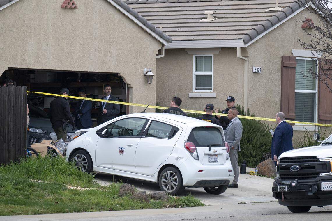 Law enforcement officers investigate a crime scene at a home on Mill Water Circle in Rancho Cordova where four people were found shot to death on Tuesday, Jan. 27, 2026.