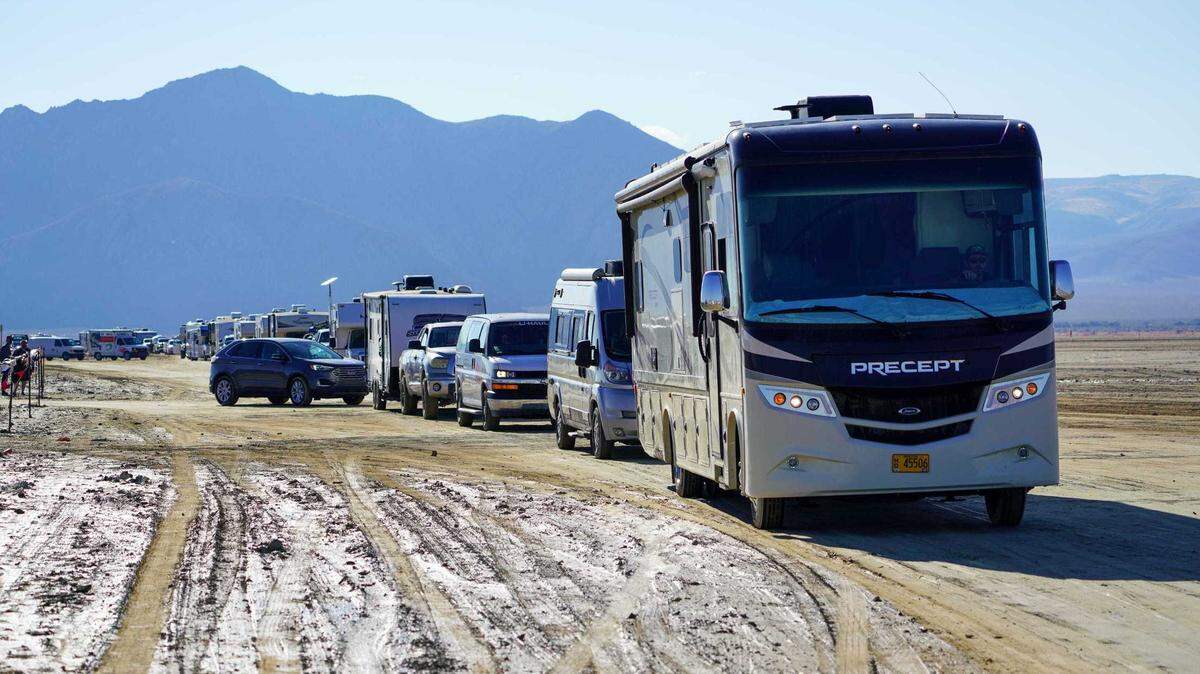 A line of RVs, campers and other vehicles drive out of Burning Man on Labor Day.