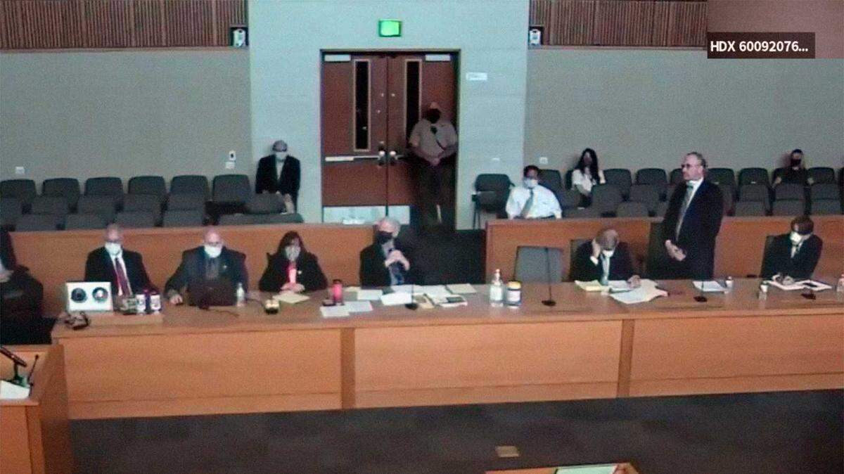 PG&E CEO Bill Johnson stands in Butte Superior Court in Chico, Calif., on Tuesday, June 16, 2020, as the embattled utility entered 85 guilty pleas in connection with the 2018 Camp Fire that devastated the town of Paradise in the worst wildfire in state history. The names and photographs of each of the 84 victims PG&E took responsibility for were identified during the hearing.