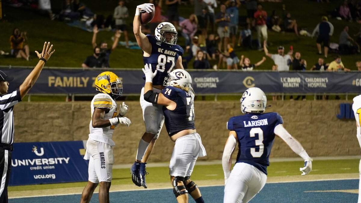 McCallan Castles celebrates his go-ahead touchdown catch from Carson Crawford as UC Davis moved to 5-0 with a 27-20 victory over Idaho on Saturday night.