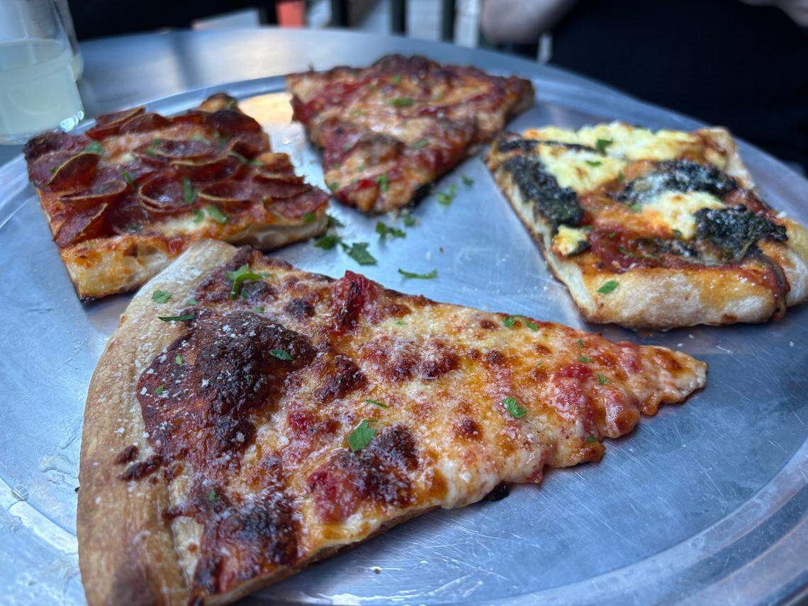 Cheese, pepperoni, sausage and a daily rotating special topping (spinach and ricotta seen here) are on the pizza menu at the Michelin-recommended Majka Pizzeria & Bakery in downtown.