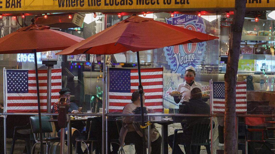 Patrons sit outdoors for dinner at Mel’s Drive-In restaurant in West Hollywood in November. Restaurant prices surged as the COVID-19 pandemic eased as inflation, jobs and supplies drove up costs in Sacramento and across the state.