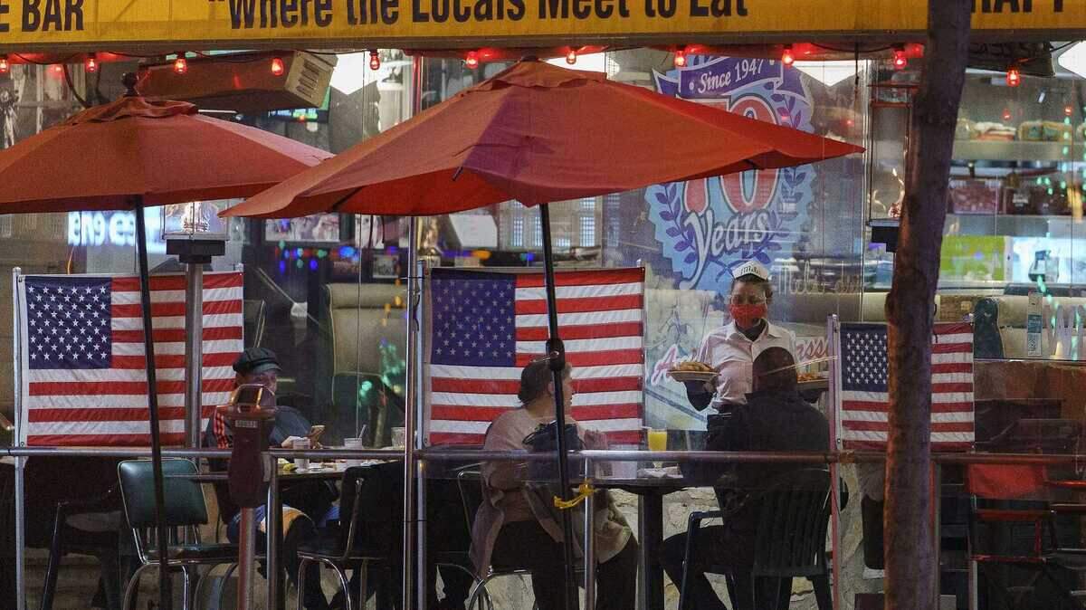 Patrons sit outdoors for dinner at Mel’s Drive-In restaurant in West Hollywood in November. Restaurant prices surged as the COVID-19 pandemic eased as inflation, jobs and supplies drove up costs in Sacramento and across the state.