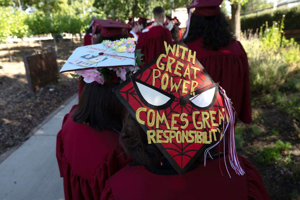 A C.K. McClatchy student wears a Spiderman-themed mortarboard as students take part in their commencement ceremony on Tuesday at Sutter Health Park.