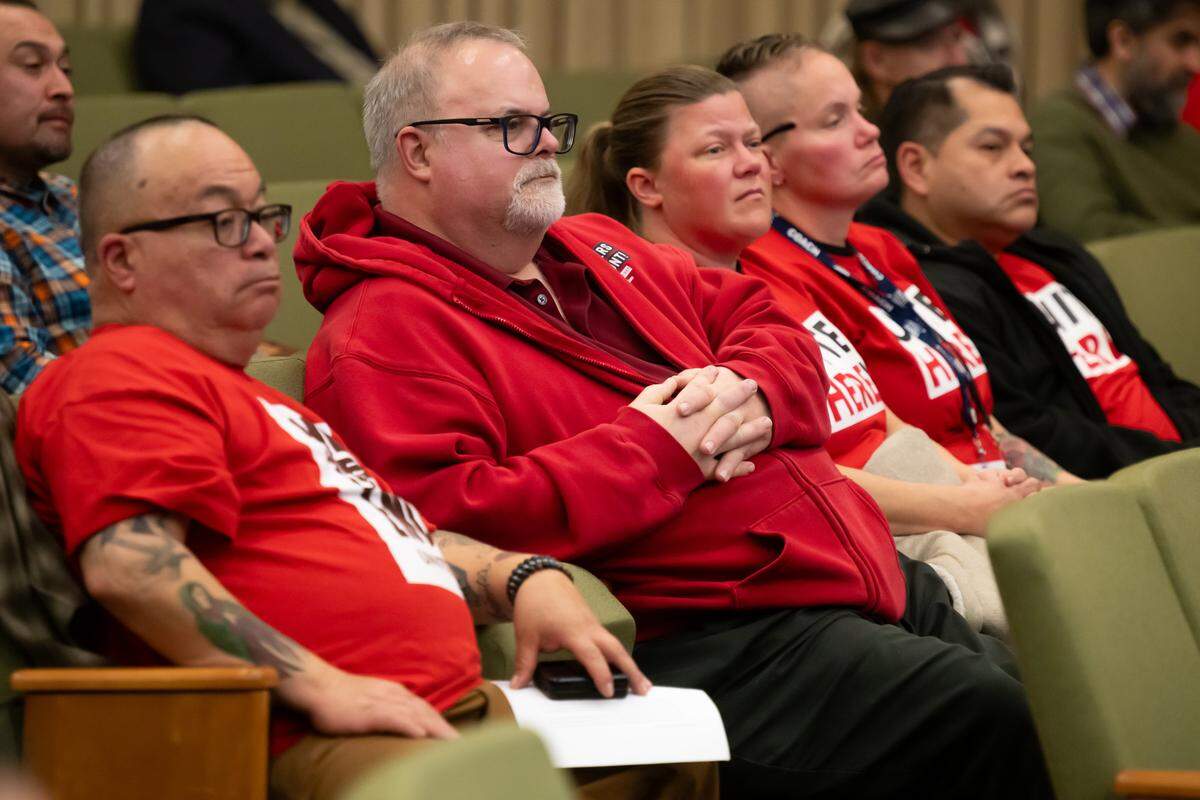 Protestors organized by Unite Here Local 49 listen to a discussion of an agreement to offer billboards to developers in the Railyards District during a city council meeting at City Hall in Sacramento on Tuesday. The protestors wanted the city to release an estimate of how much the developers will make off the billboards, which the developers are leasing free of charge.