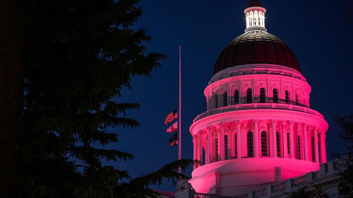 The Capitol dome is lit pink in California after the U.S. Supreme Court’s decision on Dobbs v. Jackson earlier in the day Friday, June 24, 2022, effectively overturning Roe v. Wade. Planned Parenthood Advocates Mar Monte planned a vigil outside the Capitol, which drew a diverse range of activists supporting women’s reproductive rights who later marched through downtown Sacramento.
