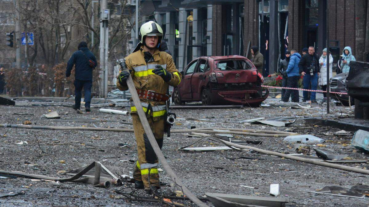Rescuers work in December at the site of a building destroyed during a Russian missile strike amidst Russia’s attack in central Kyiv. Russia launched a missile strike with Kinzhal ballistic and aeroballistic missiles early in the morning, causing serious damage to office and residential buildings in the center of the Ukrainian capital.