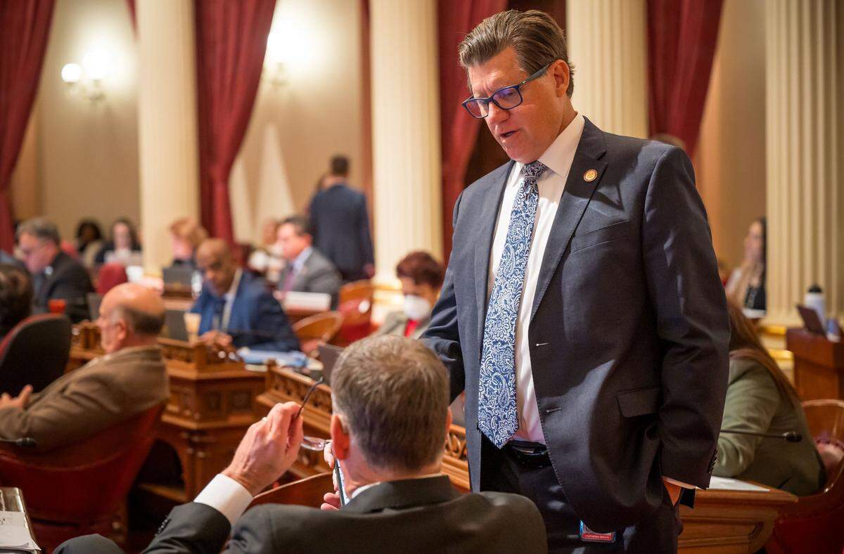 State Senate Minority Leader Brian Jones, R-San Diego, stands next to Sen. Brian Dahle, R-Bieber, to chat in the Senate chamber at the state Capitol in September. Jones opposed an attempt to modernize the California GOP platform.