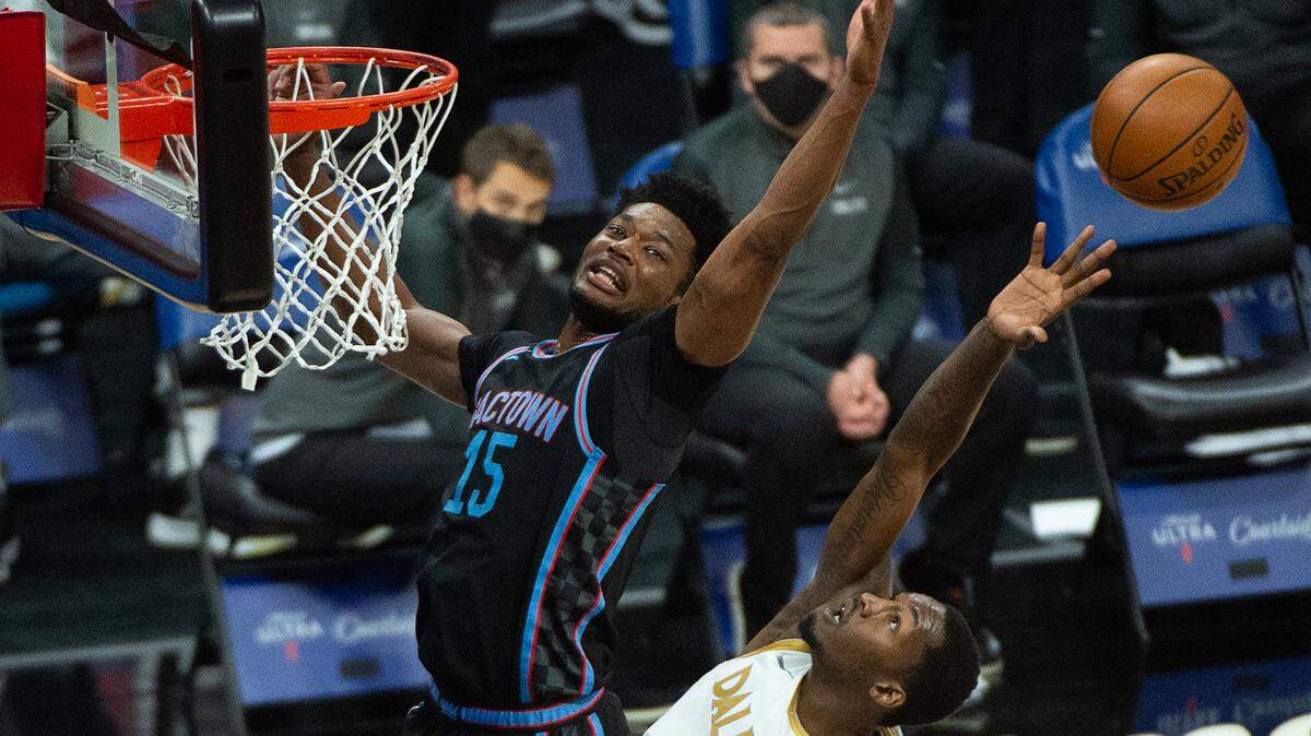 Sacramento Kings center Damian Jones (15) battles Dallas Mavericks forward Dorian Finney-Smith (10) for rebound in the third quarter during a game at Golden 1 Center on Monday, April 26, 2021 in Sacramento.