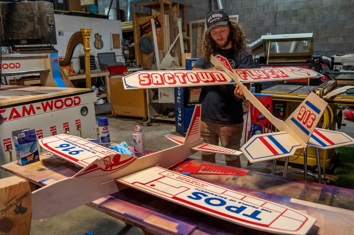 Artist Julian Sandpaper works with model airplanes in his studio in downtown Sacramento on Wednesday, June 3, 2020. “This is kind of my dream factory. I get to come here every day and make things I’ve dreamed about at night,” Sandpaper said. The airplanes remind him of flying small wooden airplanes off at Capitol Mall with his grandfather as a child.