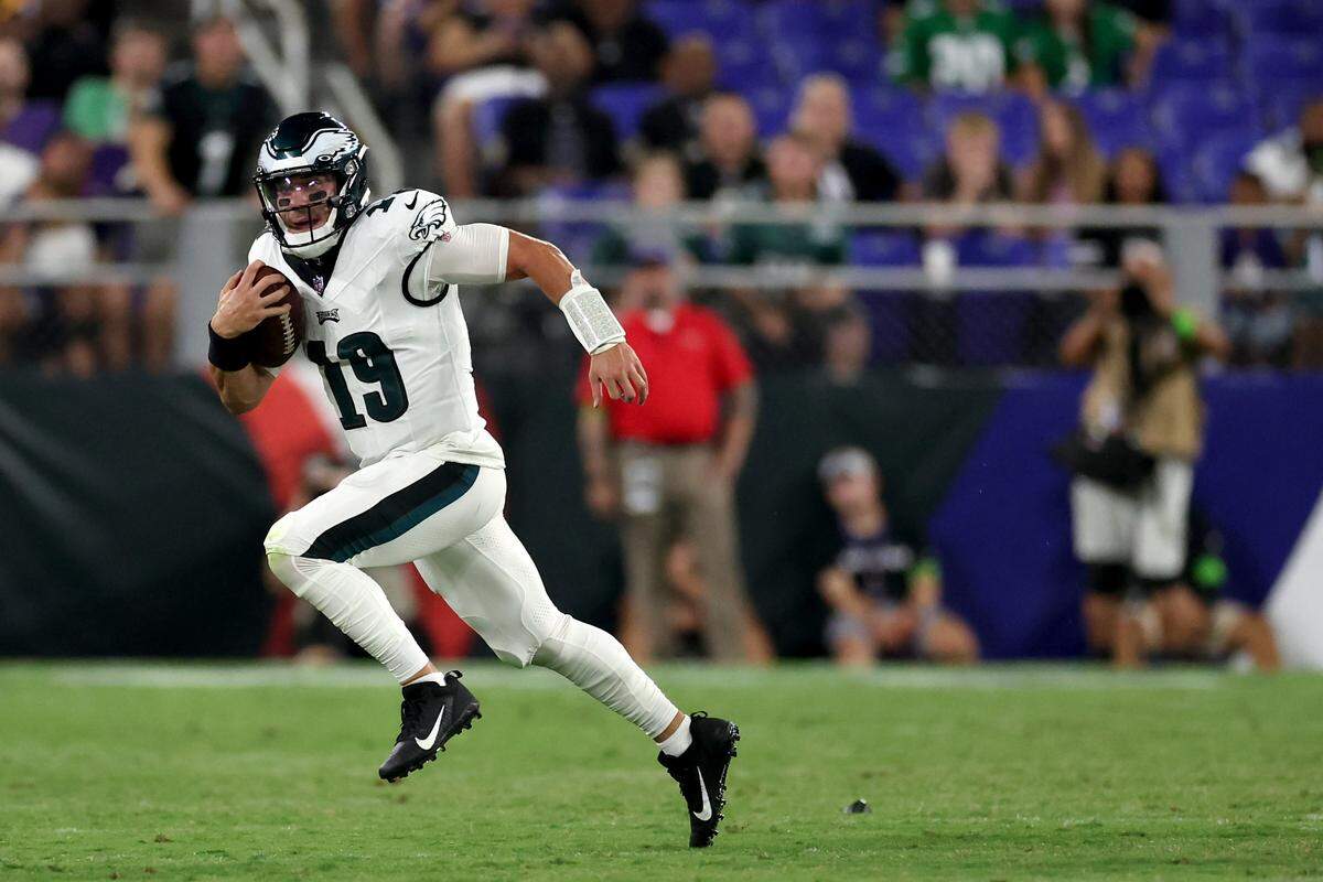 BALTIMORE, MARYLAND - AUGUST 12: Quarterback Ian Book #19 of the Philadelphia Eagles runs with the ball against the Baltimore Raves during a preseason game at M&T Bank Stadium on August 12, 2023 in Baltimore, Maryland. (Photo by Rob Carr/Getty Images)