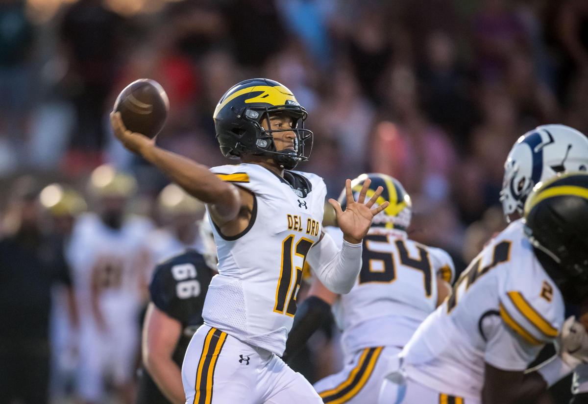 Del Oro Golden Eagles quarterback Caden Pinnick (12) throws a completion against the Casa Roble Rams in 2023.